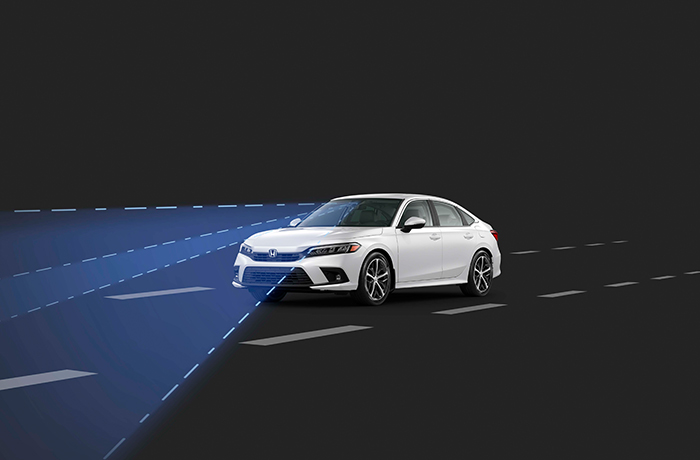 Vue en plongée d’un véhicule Honda restant dans sa voie.